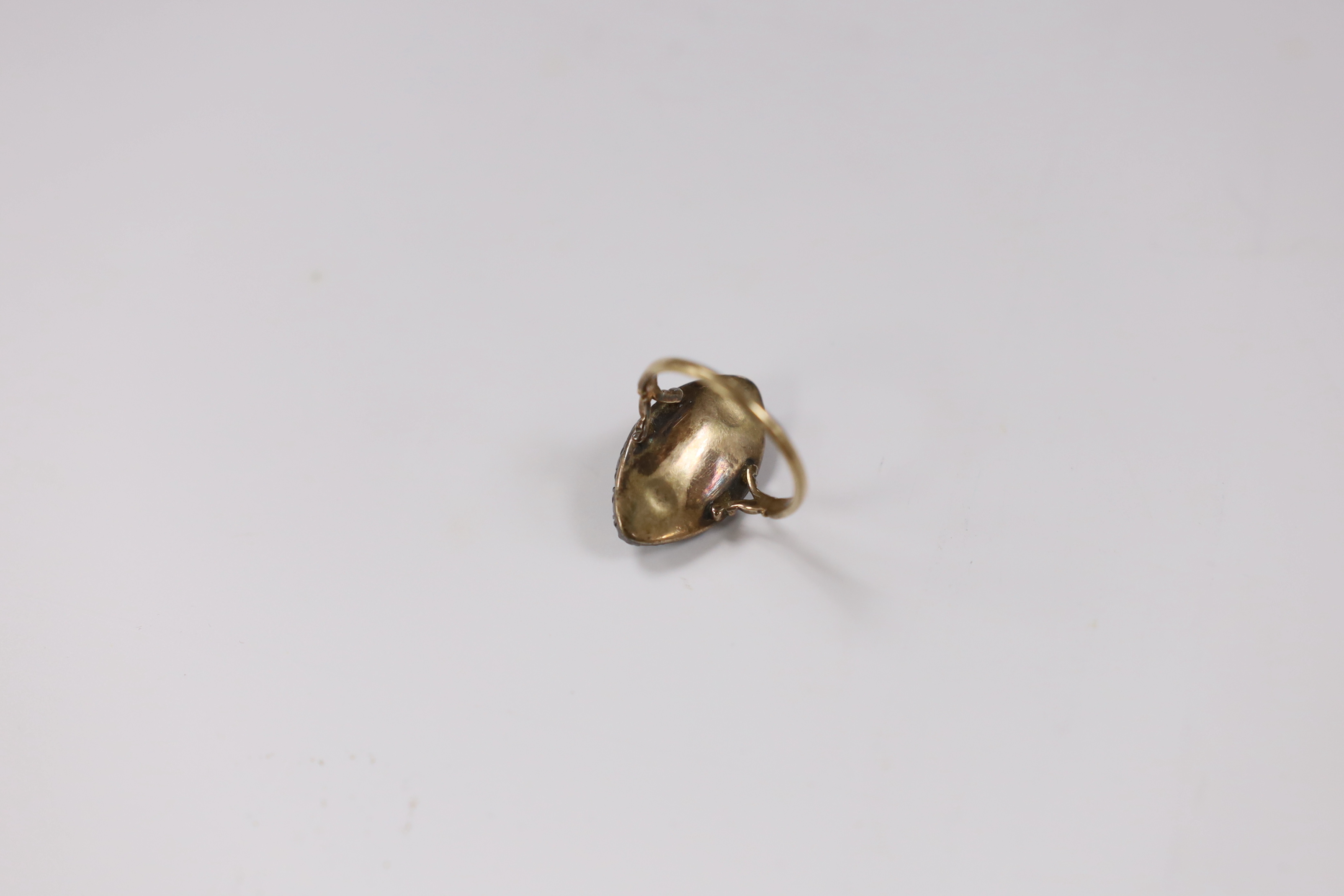 A 19th century yellow metal, enamel and rose cut diamond cluster set navette shaped ring (a.f.), size K, gross weight 5.4 grams.
